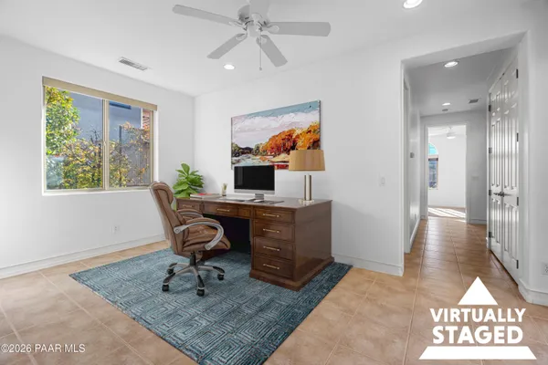 a workspace with furniture and window