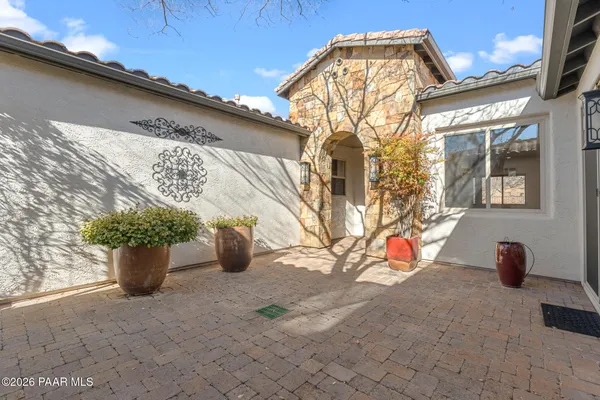 a view of a house with a potted plant