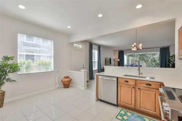 a kitchen with a sink stove and refrigerator
