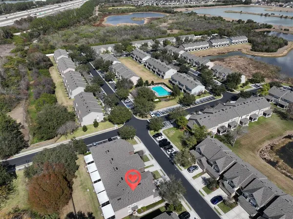 an aerial view of residential houses with outdoor space