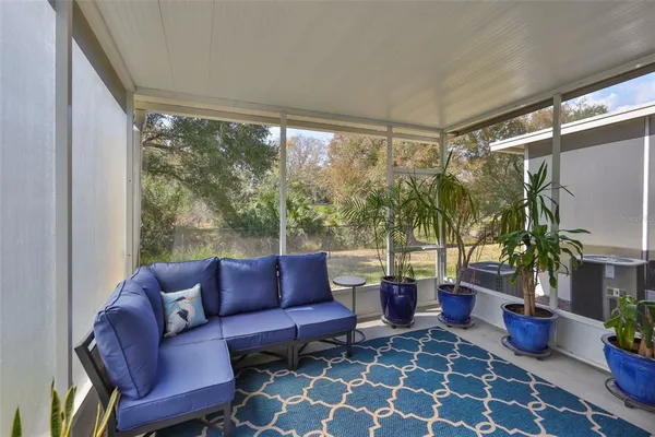 a outdoor living space with furniture and a potted plant