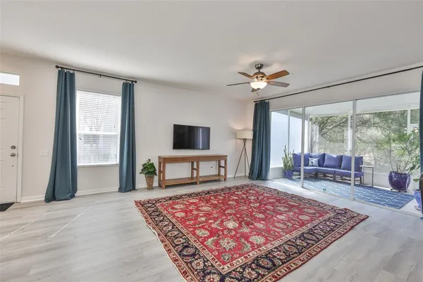 a living room with furniture and a rug