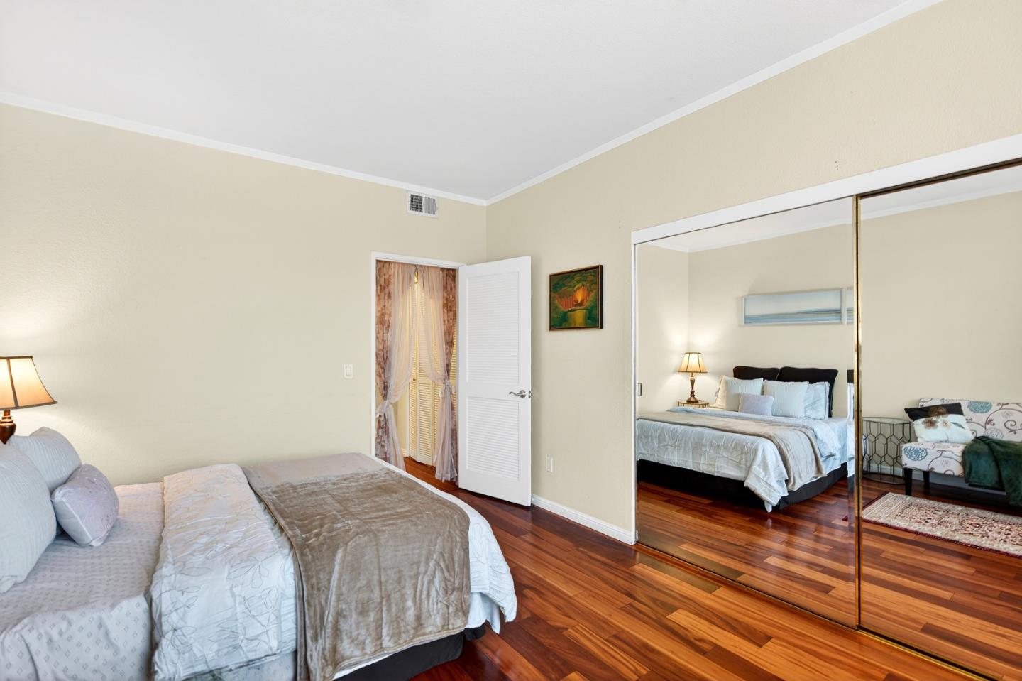 22330 Homestead Road, Unit 214 Cupertino, CA 95014 - Photo 19 of 35 a bed room with a bed and a couch