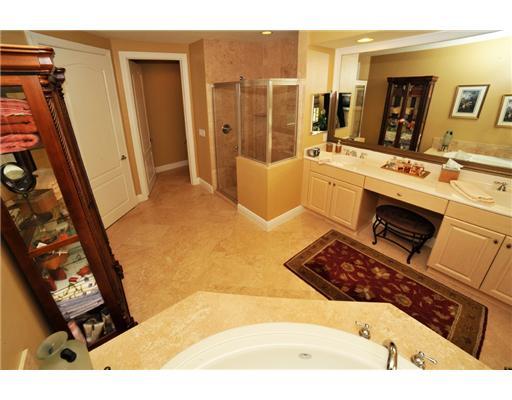 616 Northeast Francesca Lane Boca Raton, FL 33487 - Photo 11 of 14 a bathroom with a bathtub sink and mirror