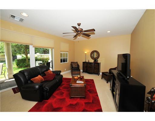 616 Northeast Francesca Lane Boca Raton, FL 33487 - Photo 12 of 14 a living room with furniture a rug and a large window