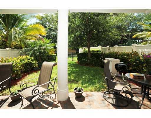 616 Northeast Francesca Lane Boca Raton, FL 33487 - Photo 14 of 14 a view of a chairs and table in backyard