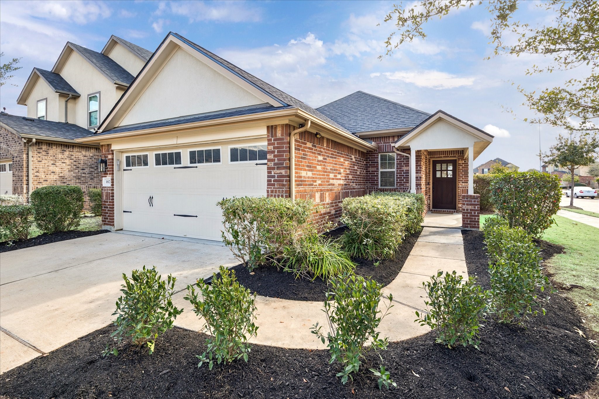 a front view of a house with garden