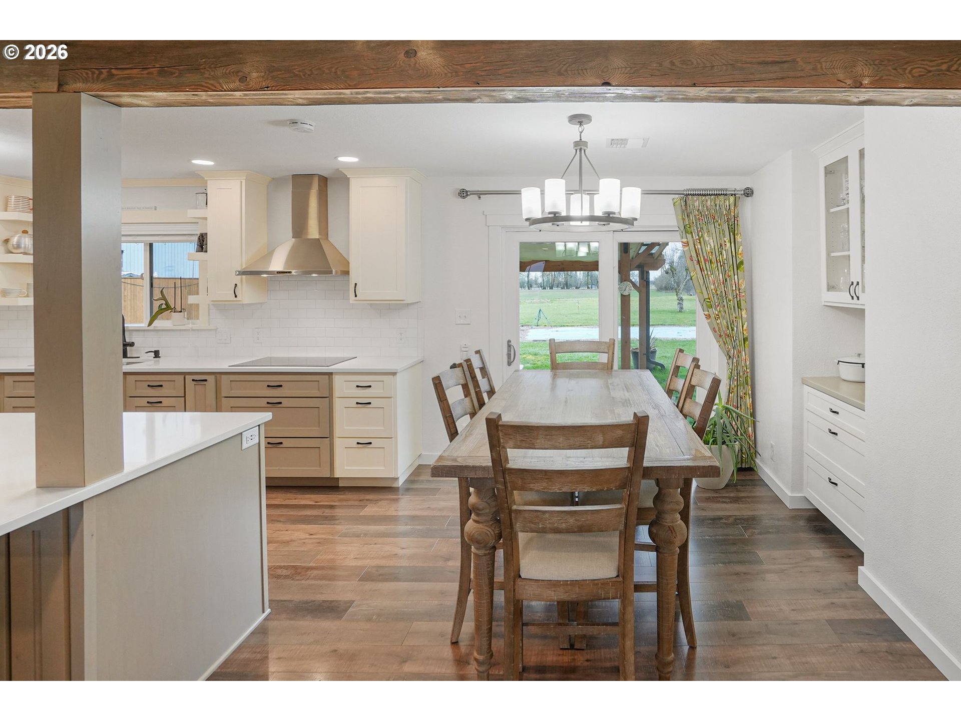 30596 Horseshoe Drive Southwest Albany, OR 97321 - Photo 17 of 43 a view of a dining room and livingroom with furniture wooden floor a rug a potted plant and a chandelier