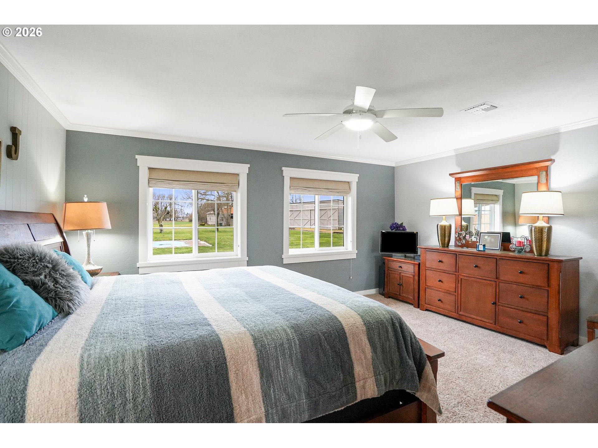 30596 Horseshoe Drive Southwest Albany, OR 97321 - Photo 19 of 43 a bedroom with a large bed and a chandelier