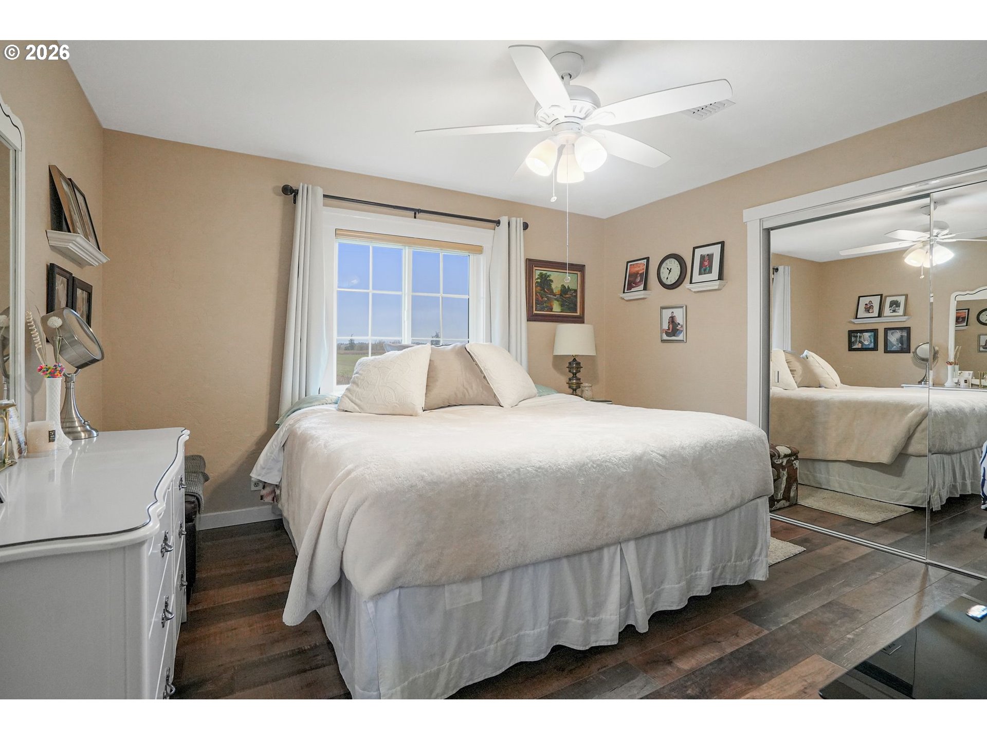 30596 Horseshoe Drive Southwest Albany, OR 97321 - Photo 20 of 43 a bedroom with a large bed and a chandelier