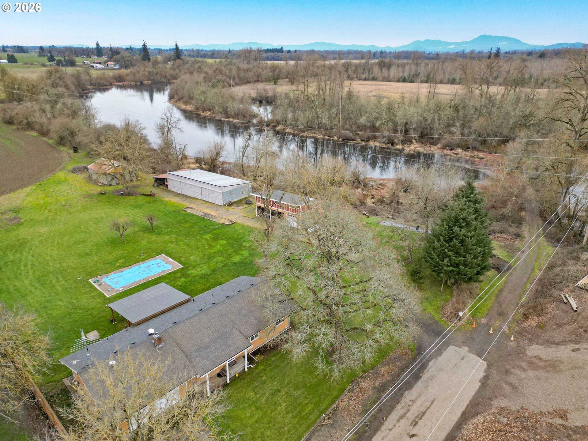 30596 Horseshoe Drive Southwest Albany, OR 97321 - Photo 33 of 43 a view of a lake with a yard and large trees