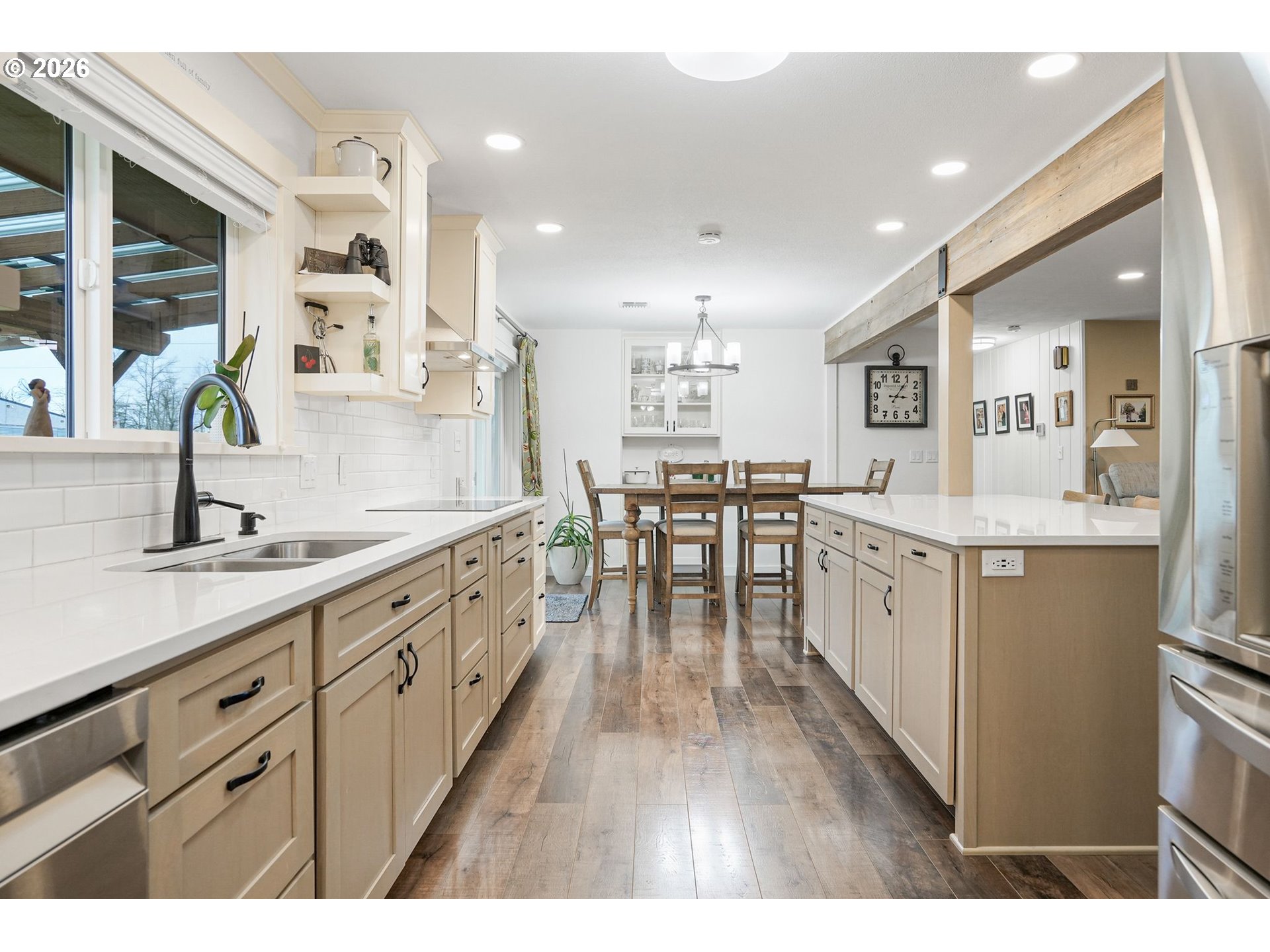 30596 Horseshoe Drive Southwest Albany, OR 97321 - Photo 10 of 43 a large white kitchen with lots of counter space wooden floor and stainless steel appliances