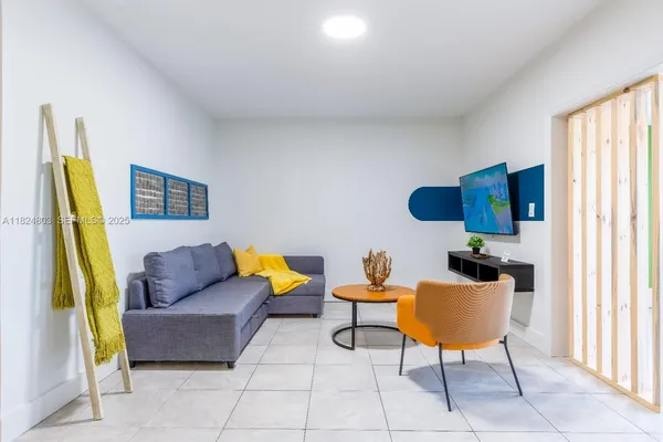 a living room with furniture and a window