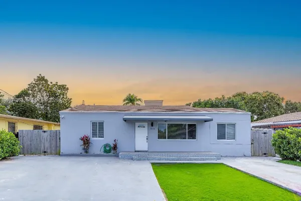 a view of house with outdoor space and sitting area