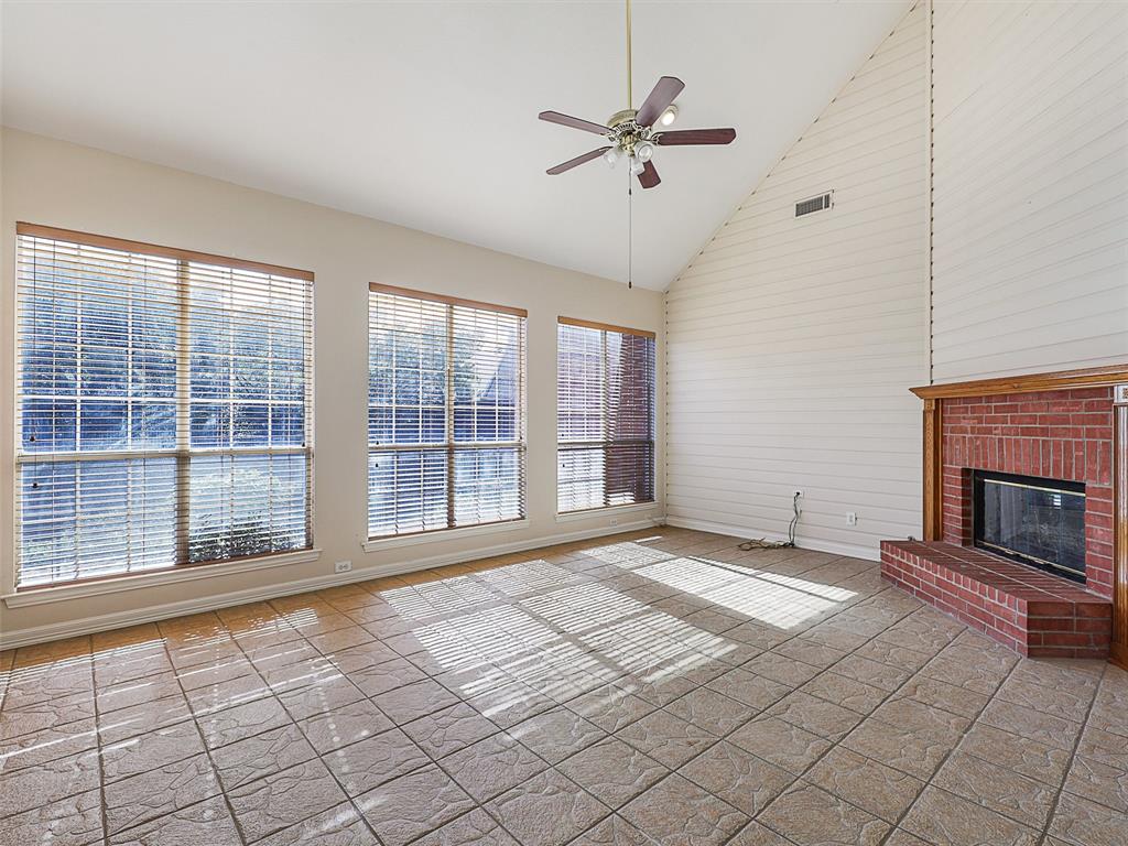 4620 Portrait Lane Plano, TX 75024 - Photo 11 of 25 a view of an empty room with a fireplace and a window