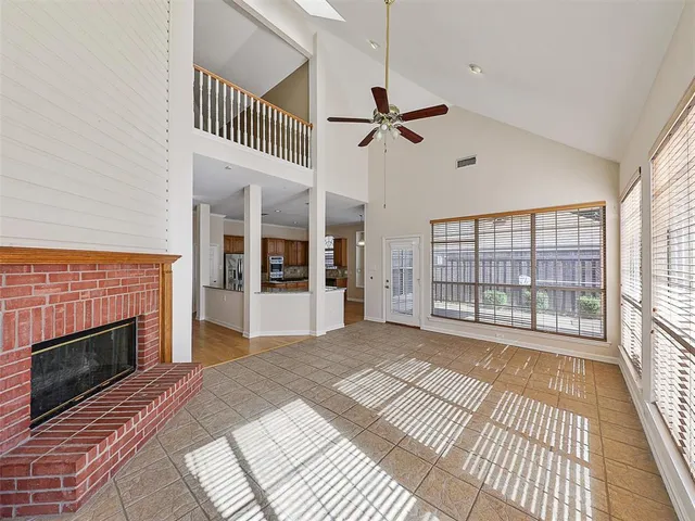 a view of a livingroom with an empty space and a fireplace