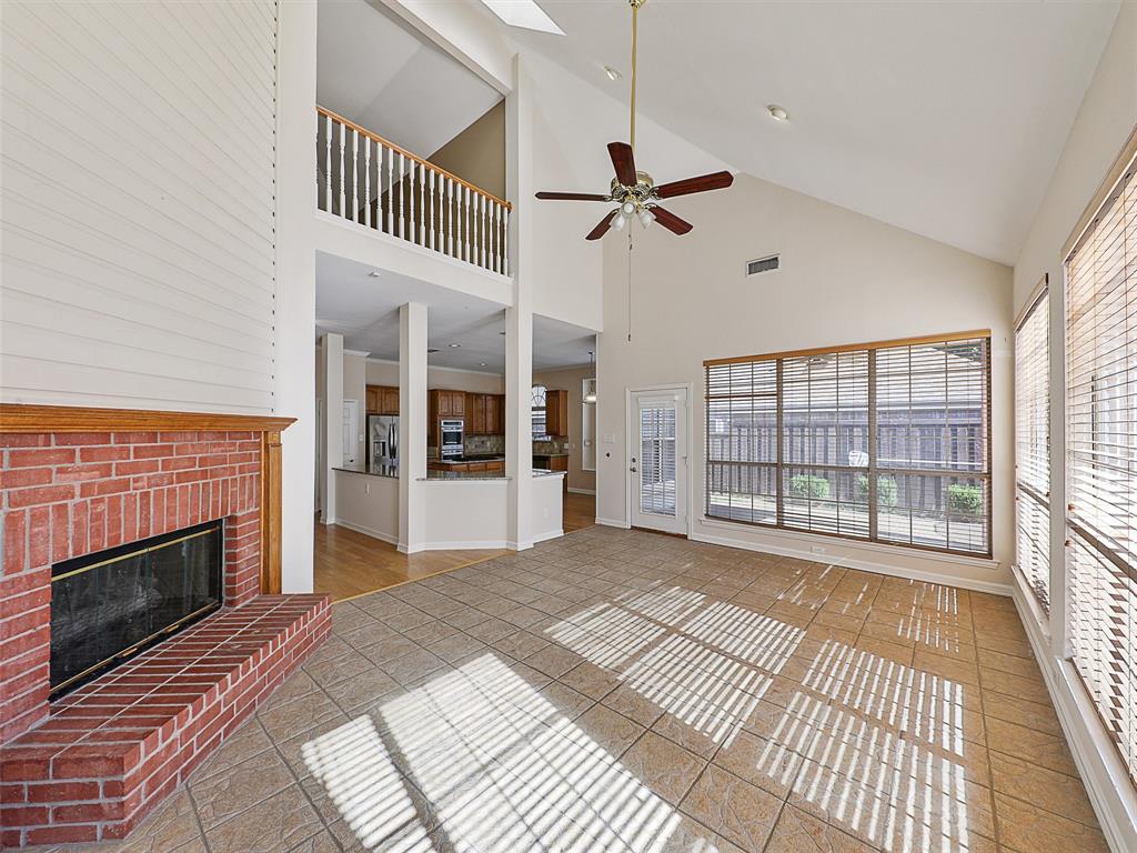 4620 Portrait Lane Plano, TX 75024 - Photo 12 of 25 a view of a livingroom with an empty space and a fireplace
