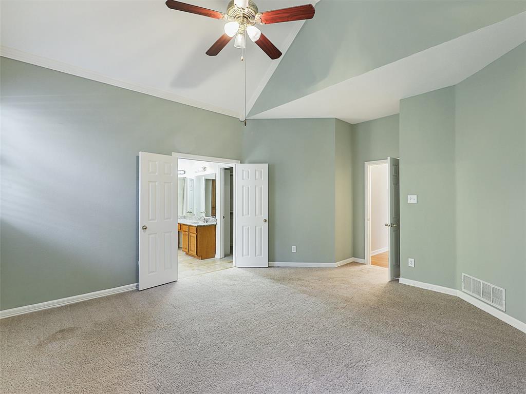 4620 Portrait Lane Plano, TX 75024 - Photo 14 of 25 an empty room with fan and windows