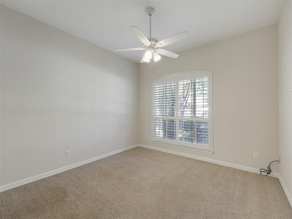4620 Portrait Lane Plano, TX 75024 - Photo 17 of 25 an empty room with a window and a fan