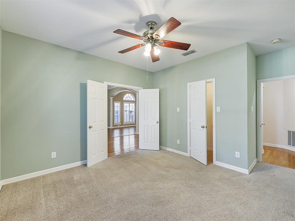 4620 Portrait Lane Plano, TX 75024 - Photo 19 of 25 an empty room with fan and windows