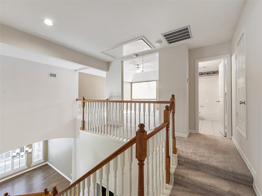 4620 Portrait Lane Plano, TX 75024 - Photo 20 of 25 a view of a hallway with windows and stairs