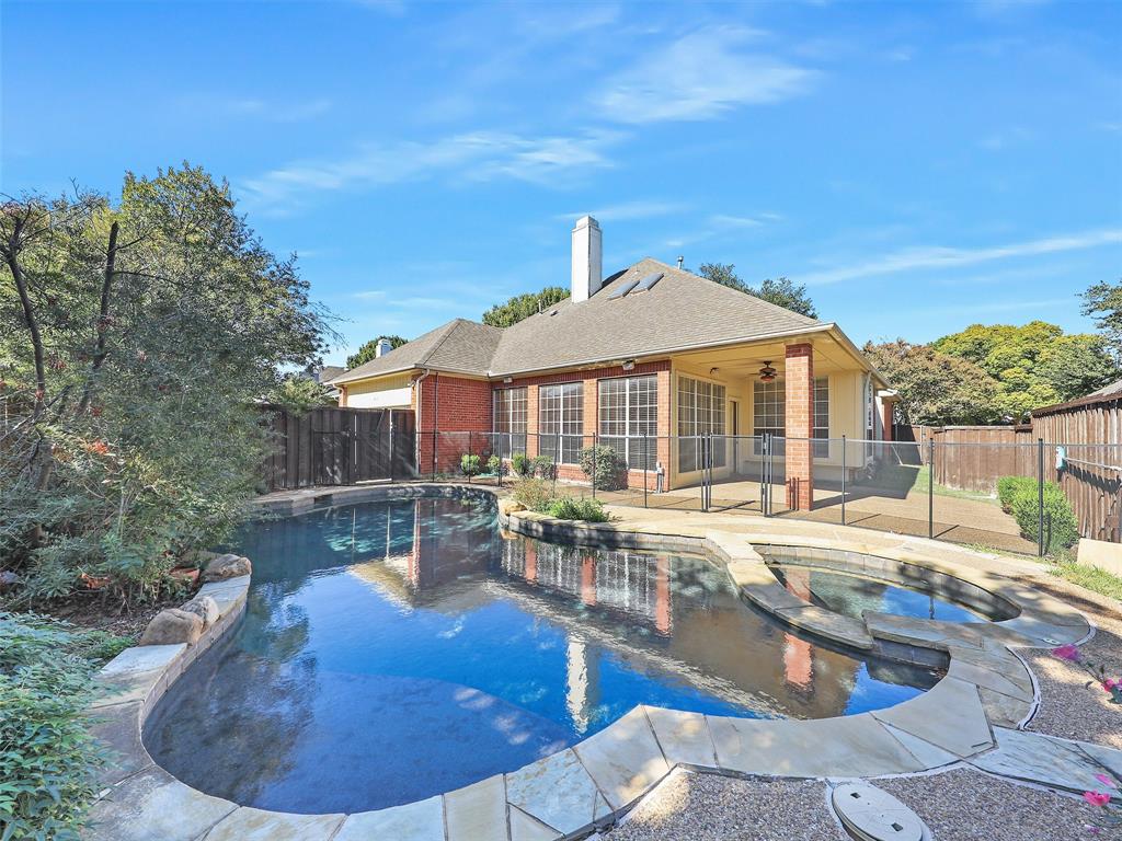 4620 Portrait Lane Plano, TX 75024 - Photo 2 of 25 a view of a house with swimming pool and sitting area