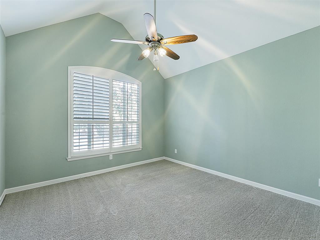 4620 Portrait Lane Plano, TX 75024 - Photo 21 of 25 an empty room with a window and a fan