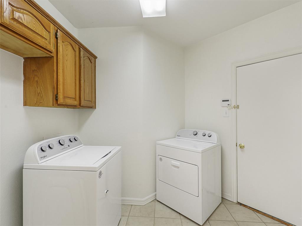 4620 Portrait Lane Plano, TX 75024 - Photo 25 of 25 a utility room with dryer and washer