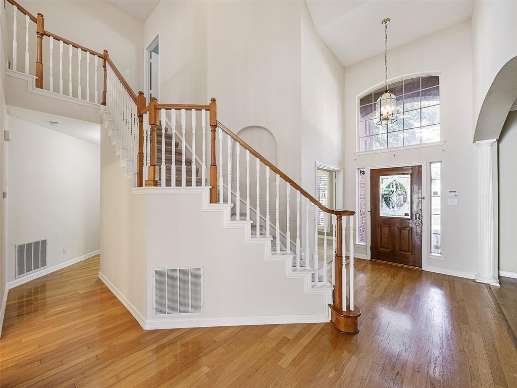 4620 Portrait Lane Plano, TX 75024 - Photo 4 of 25 a view of entryway and hall with wooden floor