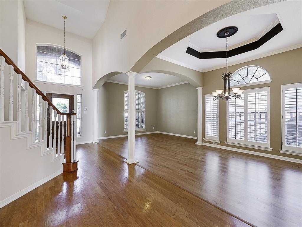 4620 Portrait Lane Plano, TX 75024 - Photo 5 of 25 wooden floor in an empty room with a window and wooden floor