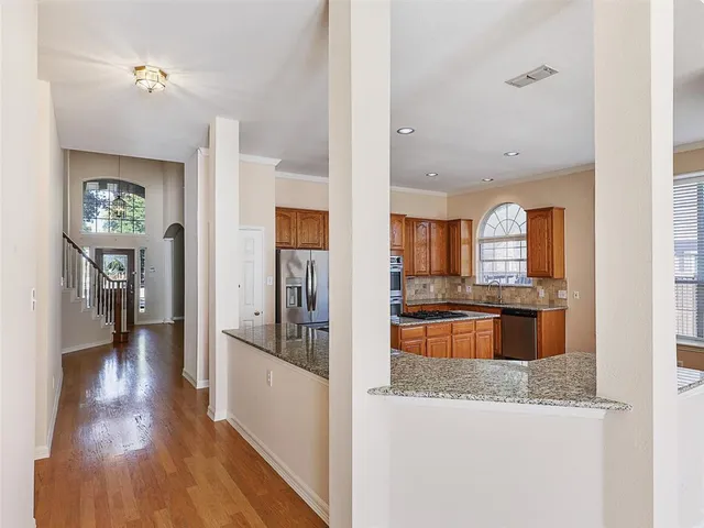 a view of a living room and kitchen