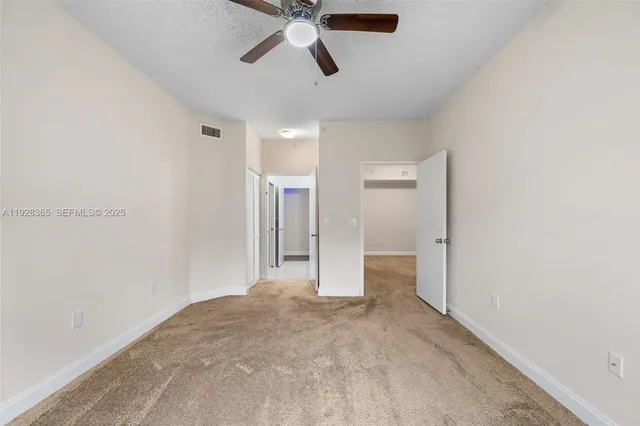 a en suite bathroom with a sink mirror and shower