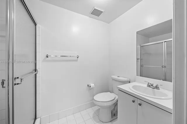 a bathroom with a sink a mirror and shower