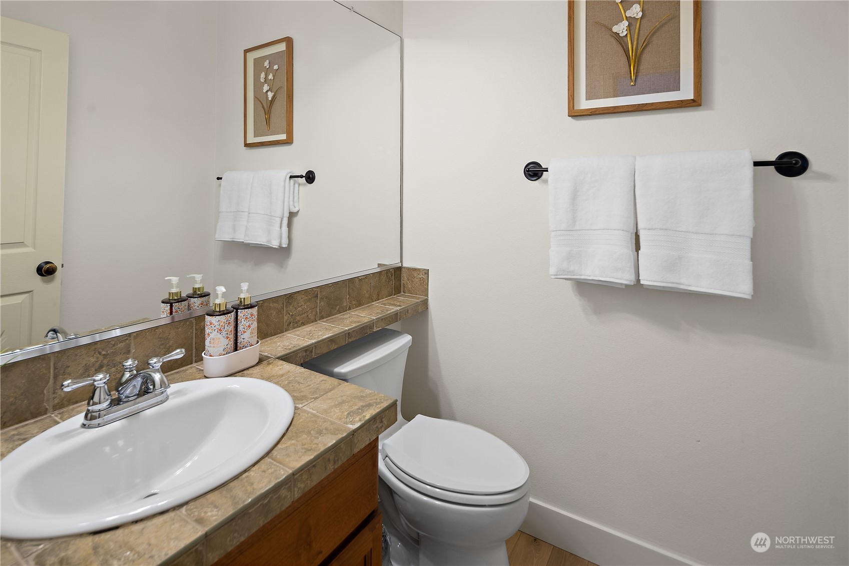 22920 36th Avenue Southeast Bothell, WA 98021 - Photo 13 of 30 a bathroom with a sink and a mirror