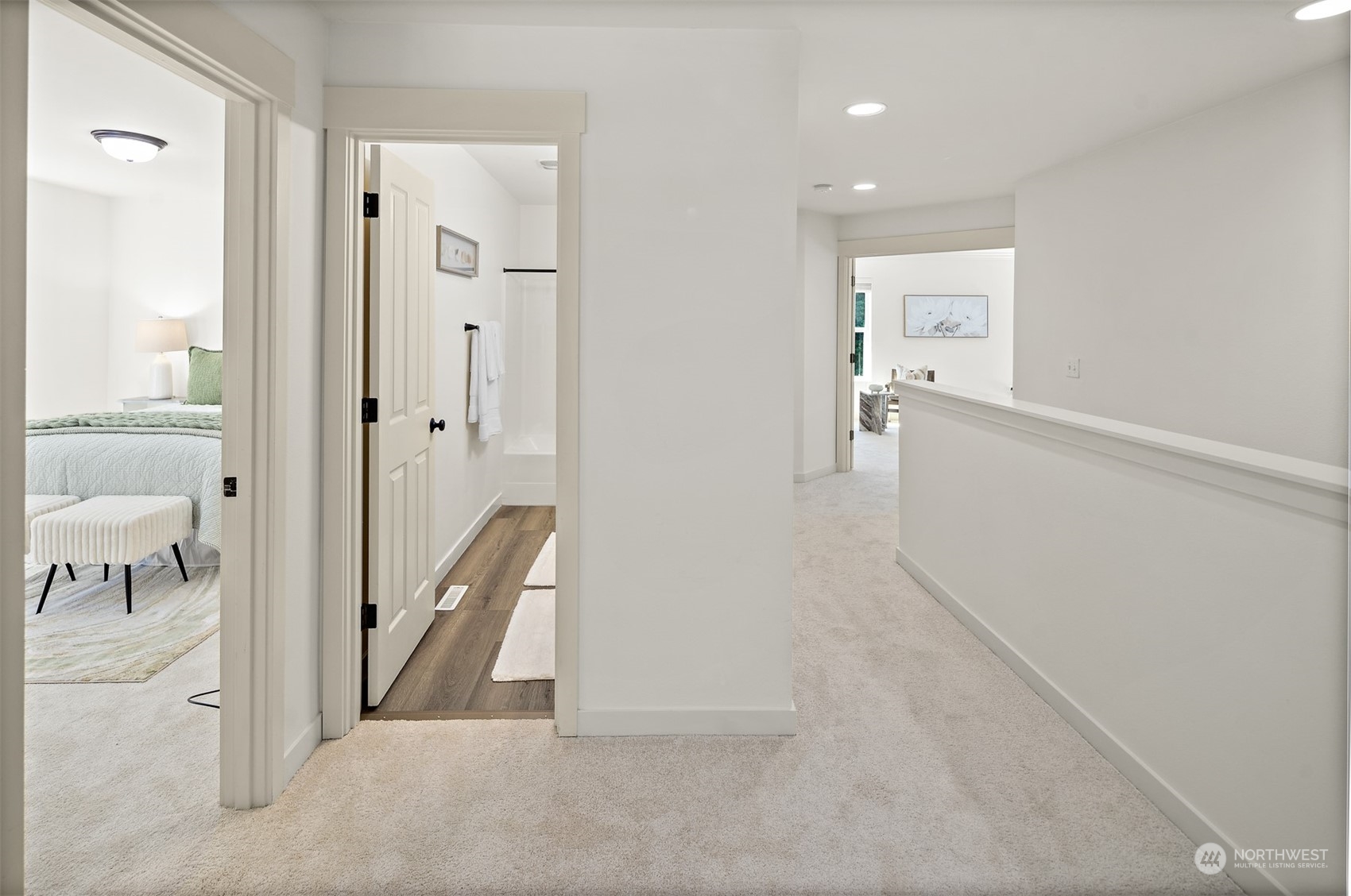 22920 36th Avenue Southeast Bothell, WA 98021 - Photo 14 of 30 a view of a hallway with wooden floor and a bathroom