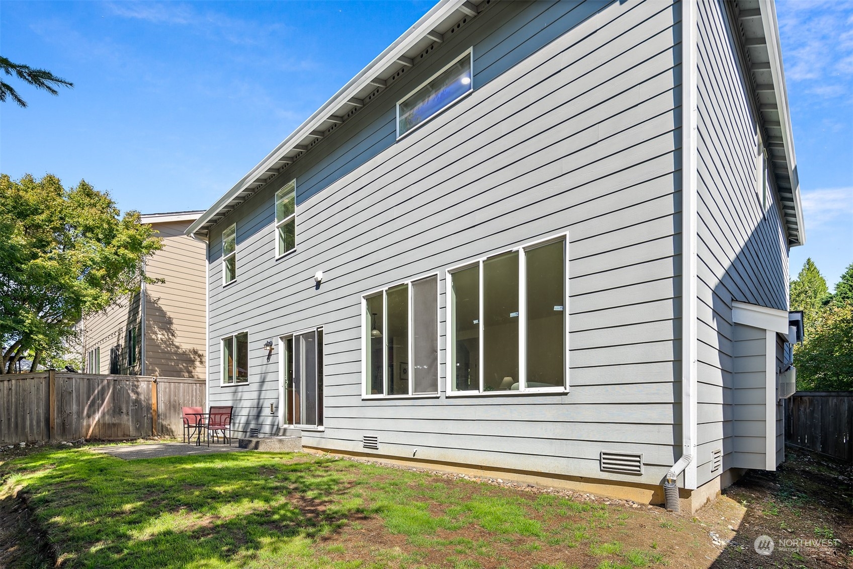 22920 36th Avenue Southeast Bothell, WA 98021 - Photo 27 of 30 a view of a house with a yard and sitting area