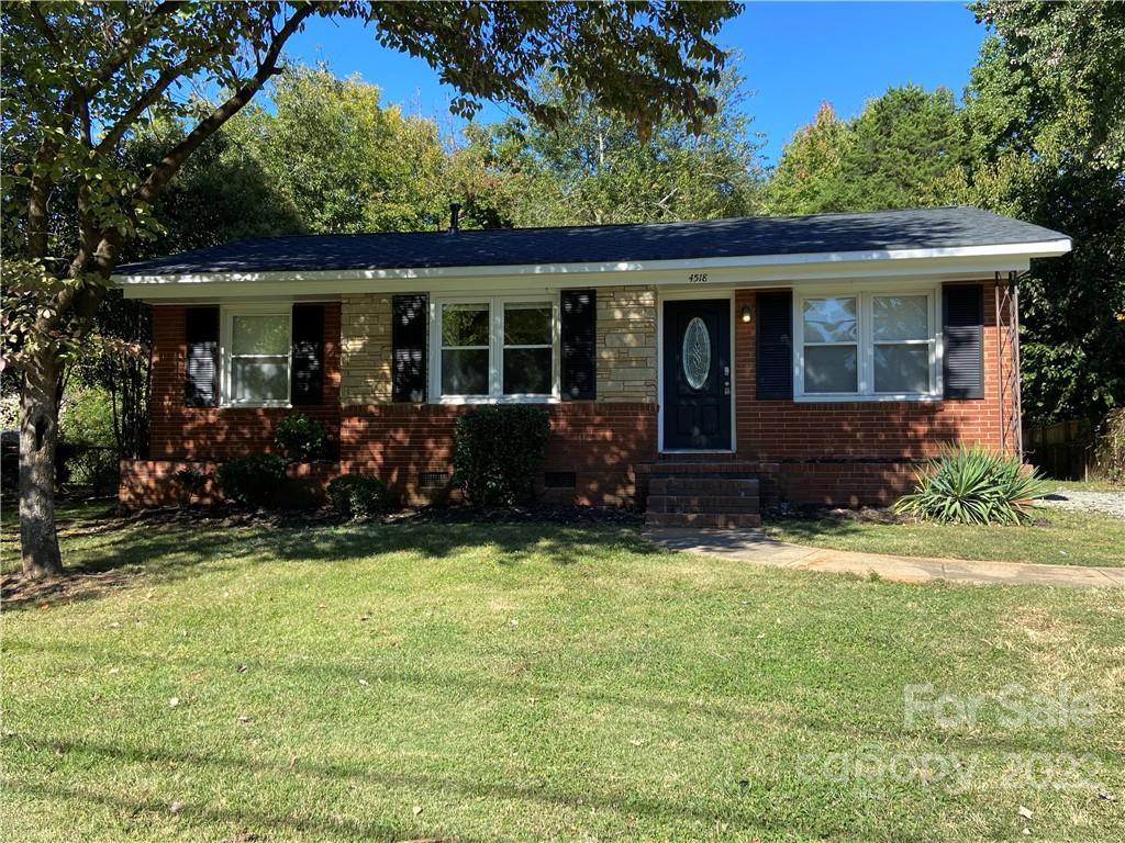 4518 Ridgeley Drive Charlotte, NC 28208 - Photo 1 of 18 front view of a house with a yard