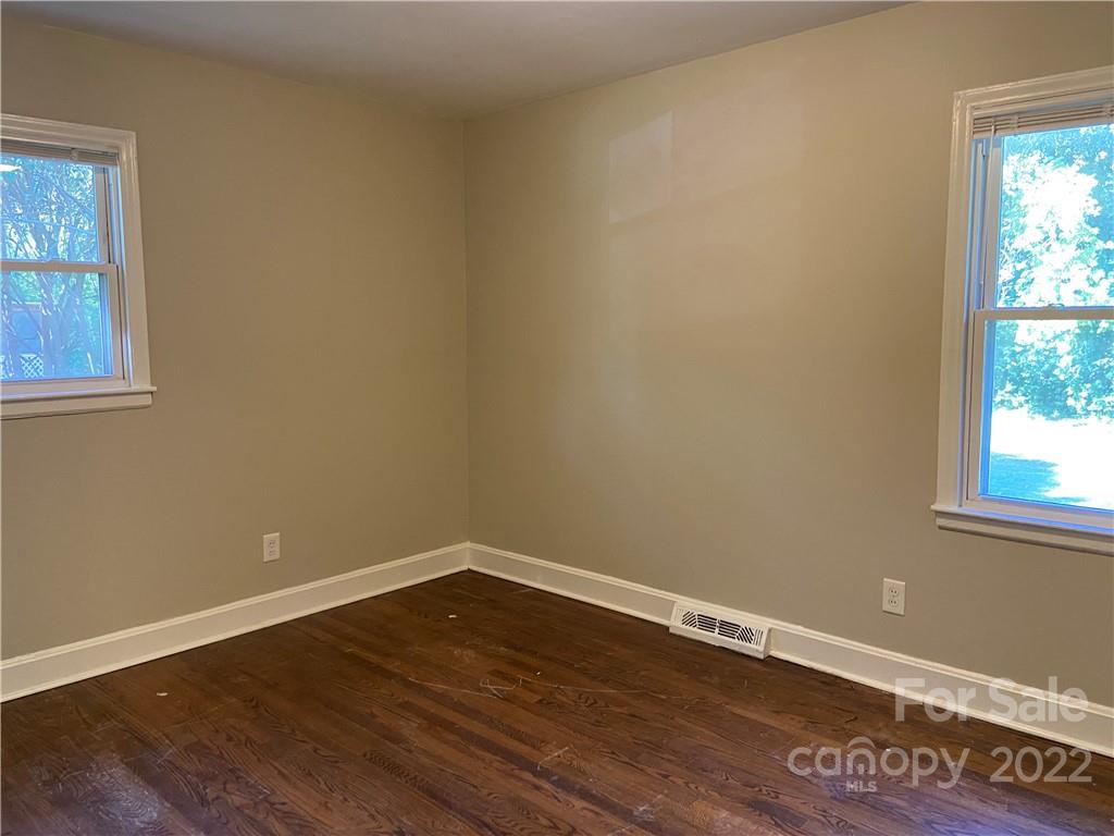 4518 Ridgeley Drive Charlotte, NC 28208 - Photo 16 of 18 a view of a room with wooden floor and window