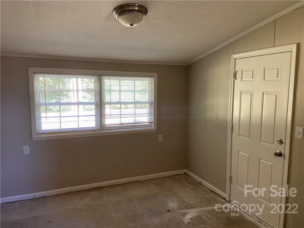 4518 Ridgeley Drive Charlotte, NC 28208 - Photo 9 of 18 an empty room with windows