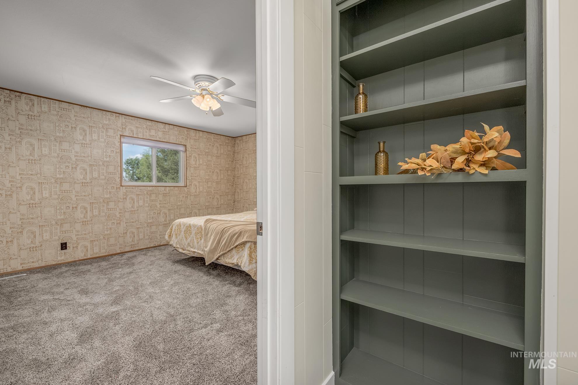 748 Pringle Road Weiser, ID 83672 - Photo 13 of 47 Built-in shelving with a rich slate finish, offering integrated storage