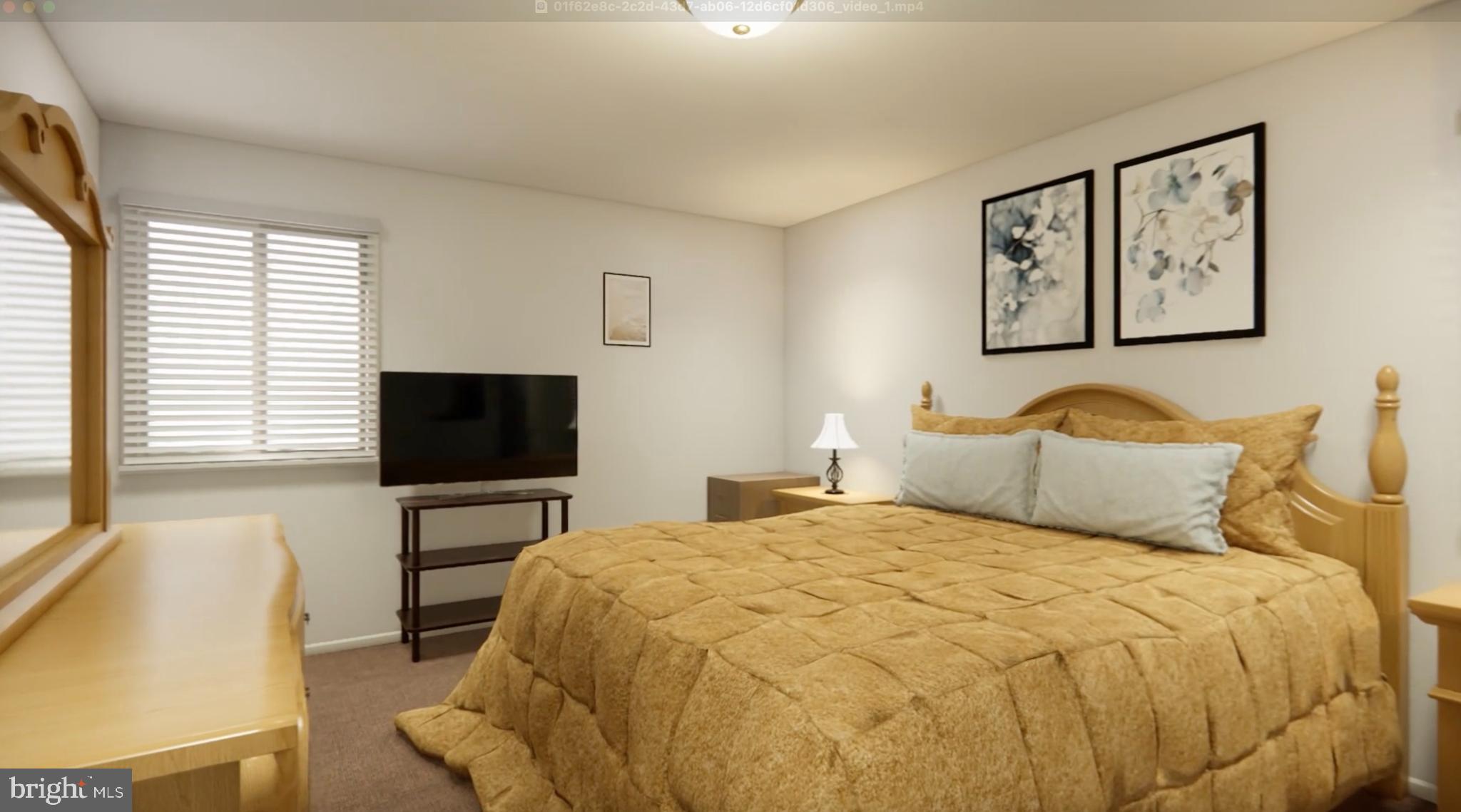 7300 Roselynn Lane Clinton, MD 20735 - Photo 21 of 28 a bedroom with a bed and a flat screen tv