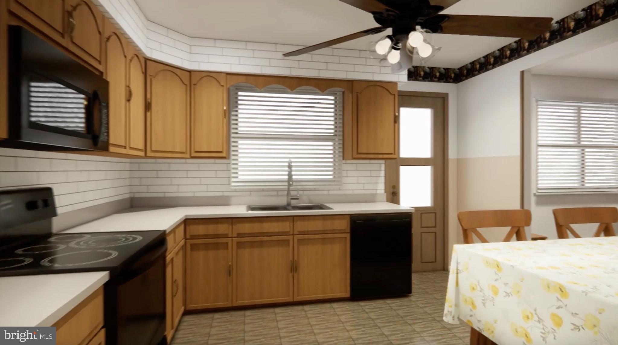 7300 Roselynn Lane Clinton, MD 20735 - Photo 6 of 28 a kitchen with a sink stove and cabinets