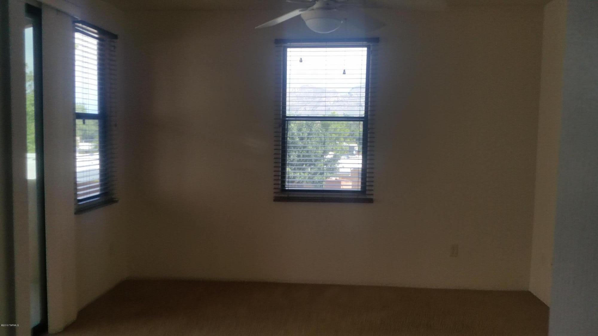 478 East Cedarvale Road Tucson, AZ 85704 - Photo 33 of 39 an empty room with a window