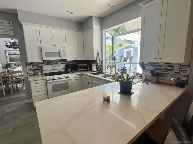 a spacious bedroom with a bed and a couch