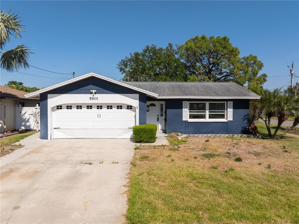 a view of a house with a yard