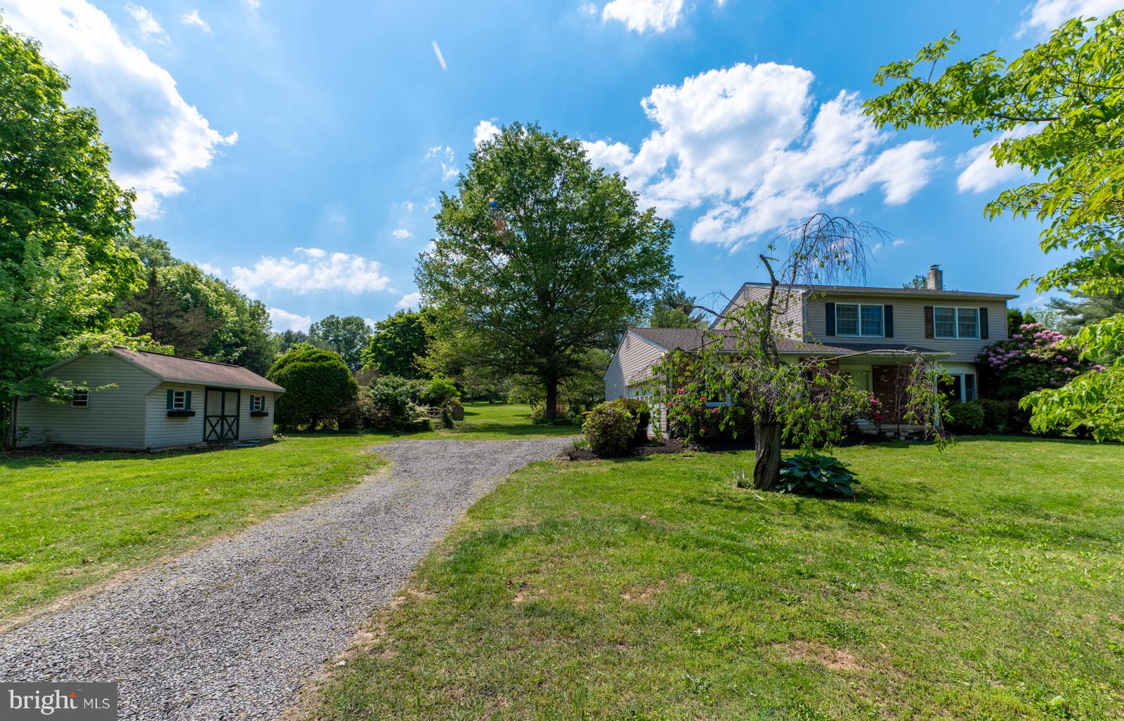223 Trythall Road Elverson, PA 19520 - Photo 7 of 78 a view of a house with a yard and a sitting area