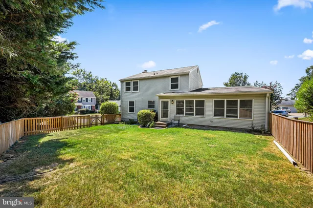 a view of a house with a back yard
