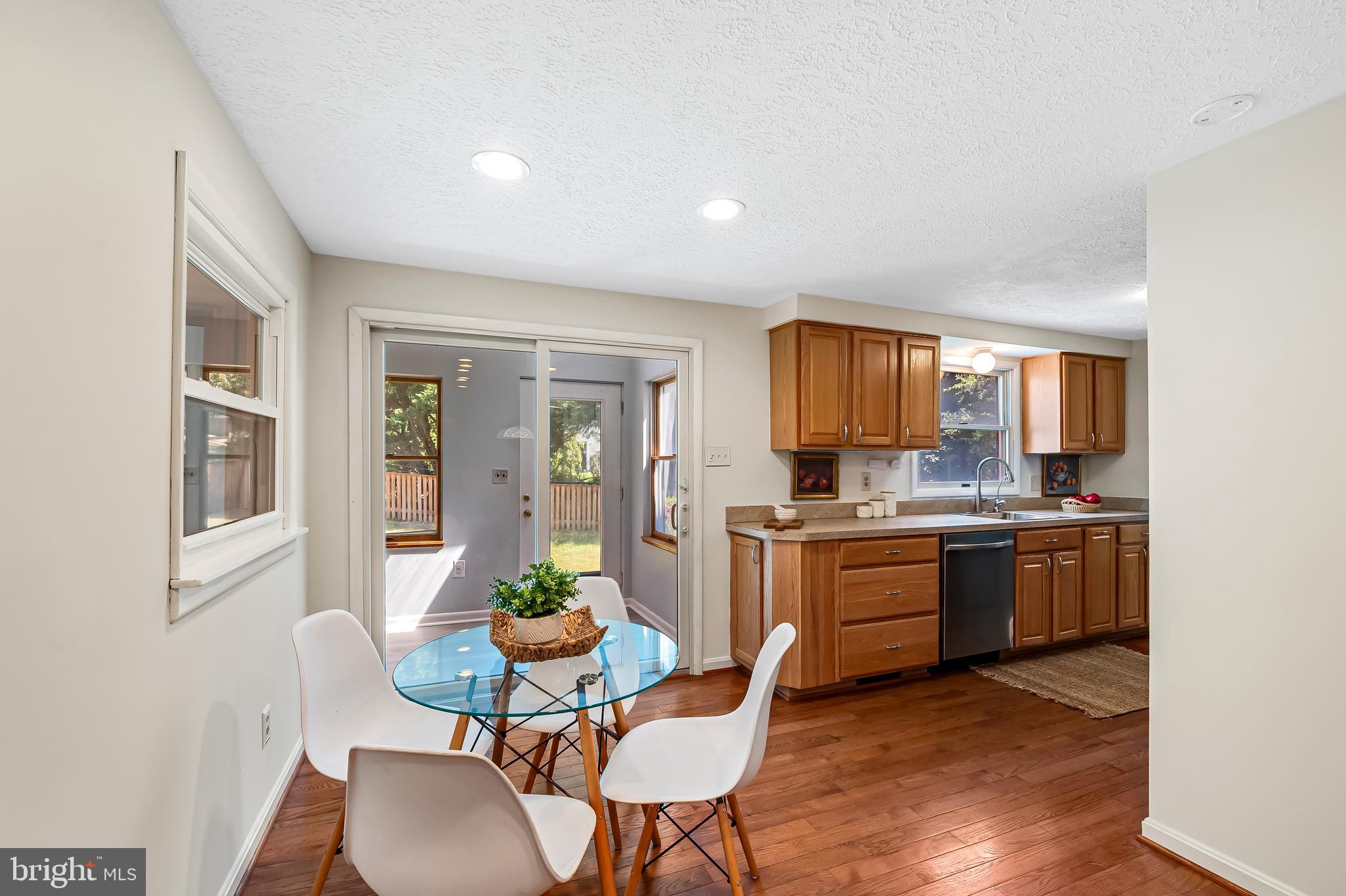 6439 Wilben Road Linthicum Heights, MD 21090 - Photo 7 of 35 Kit and breakfast area lead to sunroom.