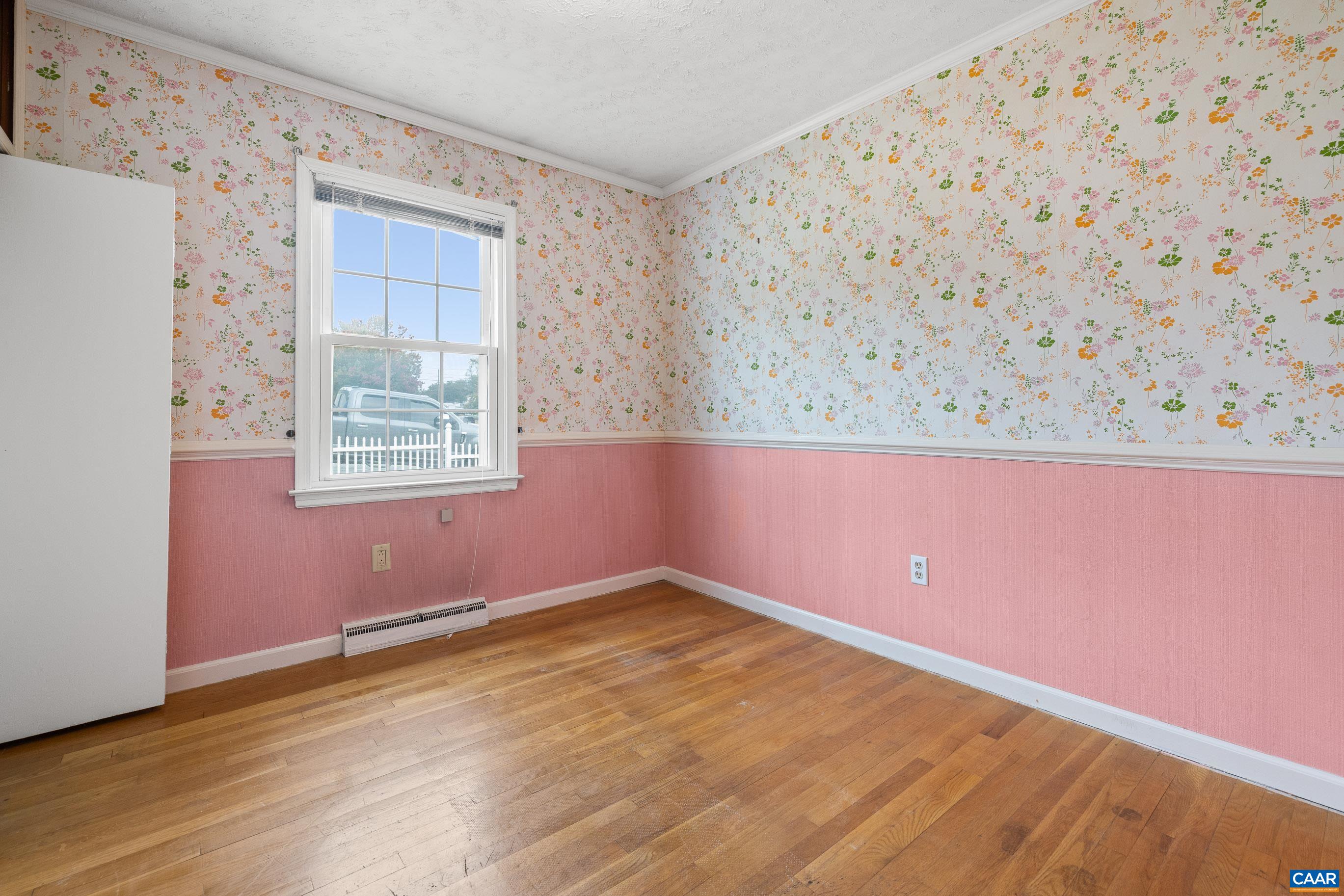 408 Carlton Road Charlottesville, VA 22902 - Photo 11 of 28 an empty room with wooden floor and windows