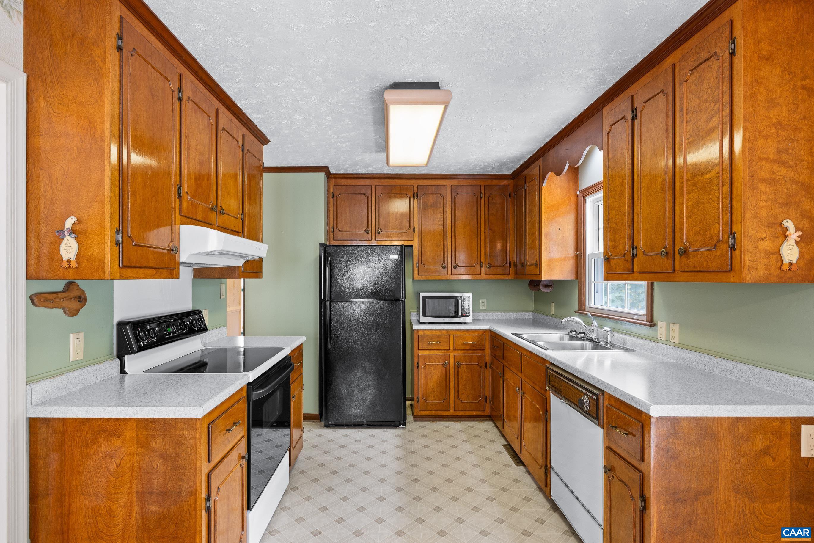 408 Carlton Road Charlottesville, VA 22902 - Photo 19 of 28 a kitchen with stainless steel appliances granite countertop a sink stove and refrigerator